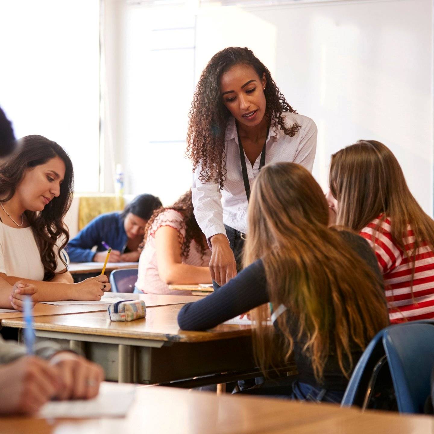 a person standing in front of a group of students