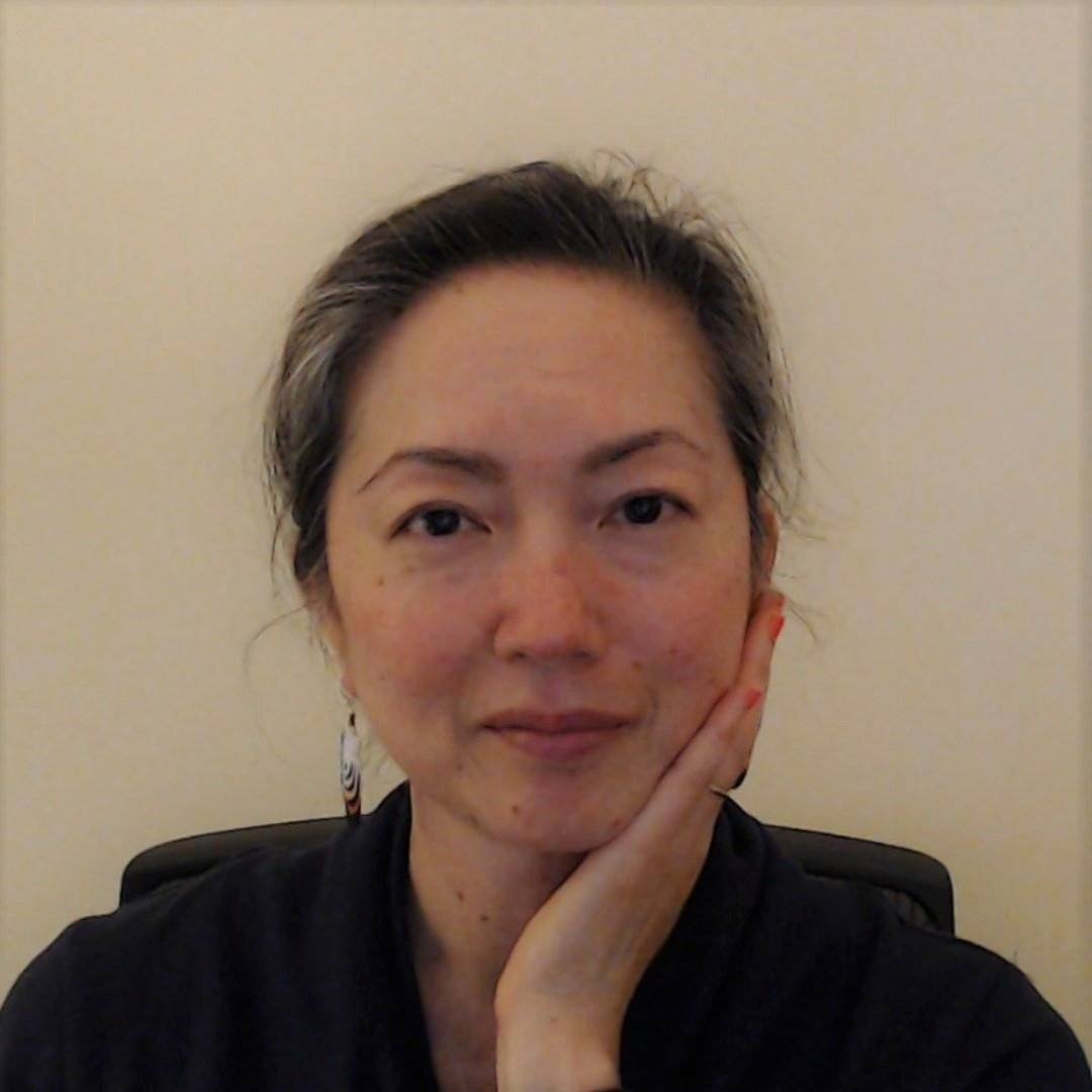 a person with her hand on her chin