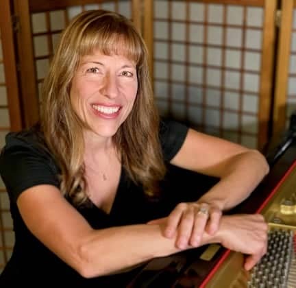 a person sitting at a piano