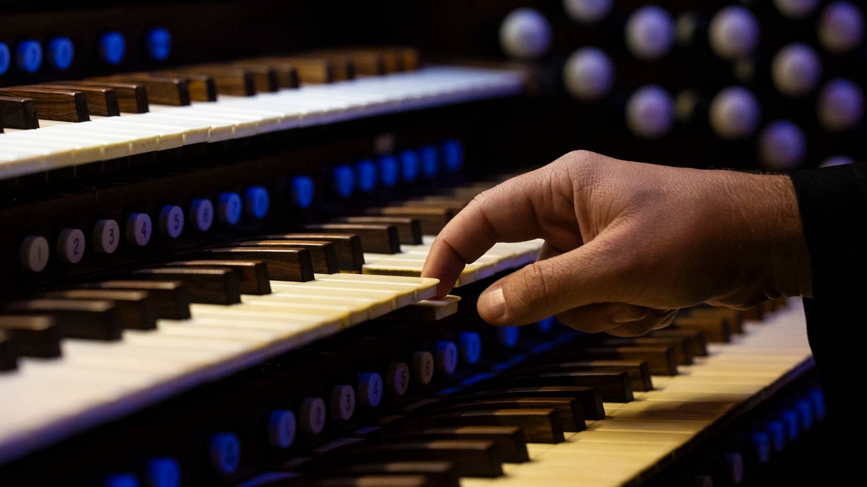 a hand on a keyboard