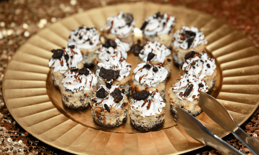 a plate of desserts with a knife and fork