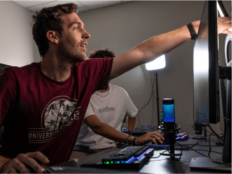 a person pointing at a computer screen