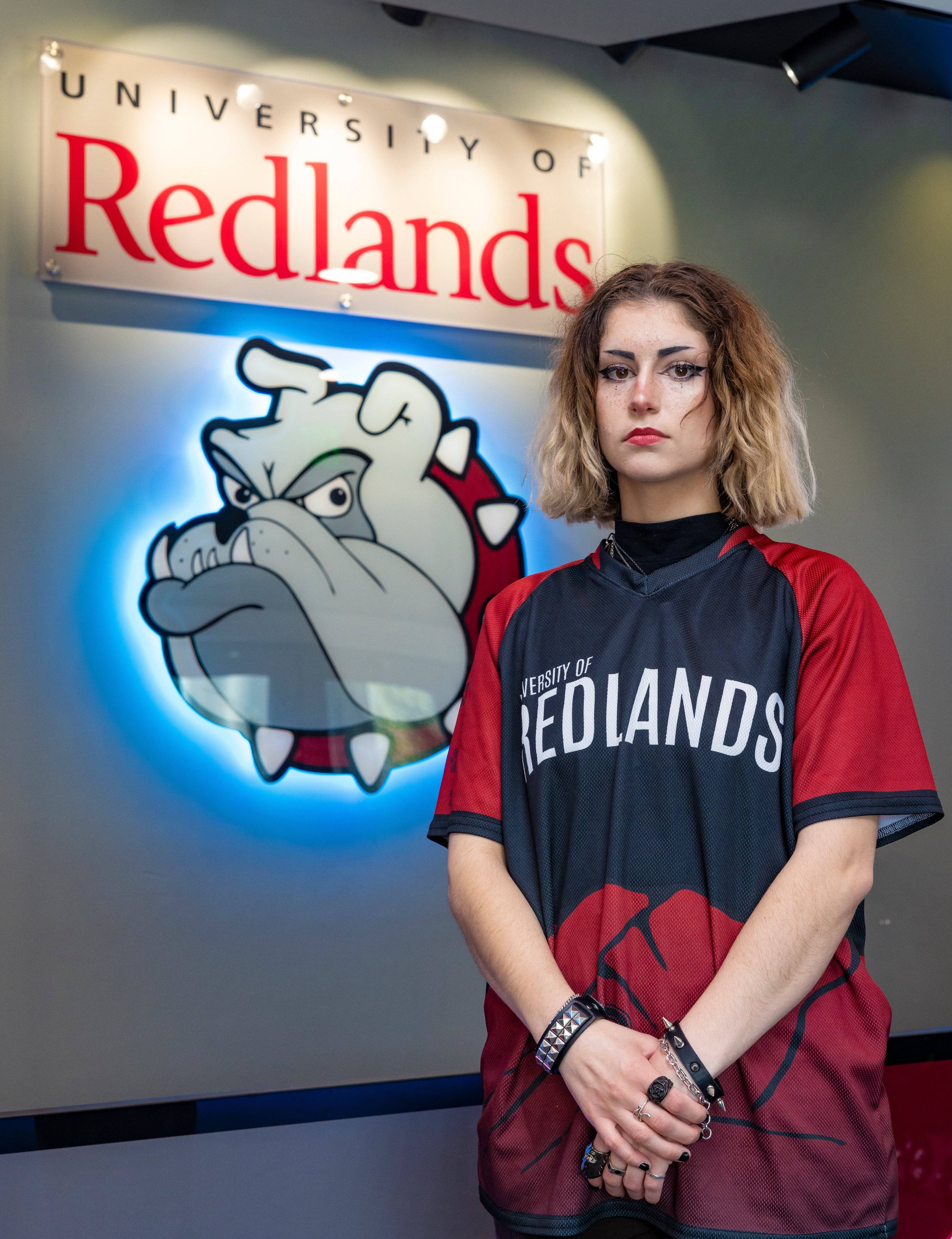 a person standing in front of a sign