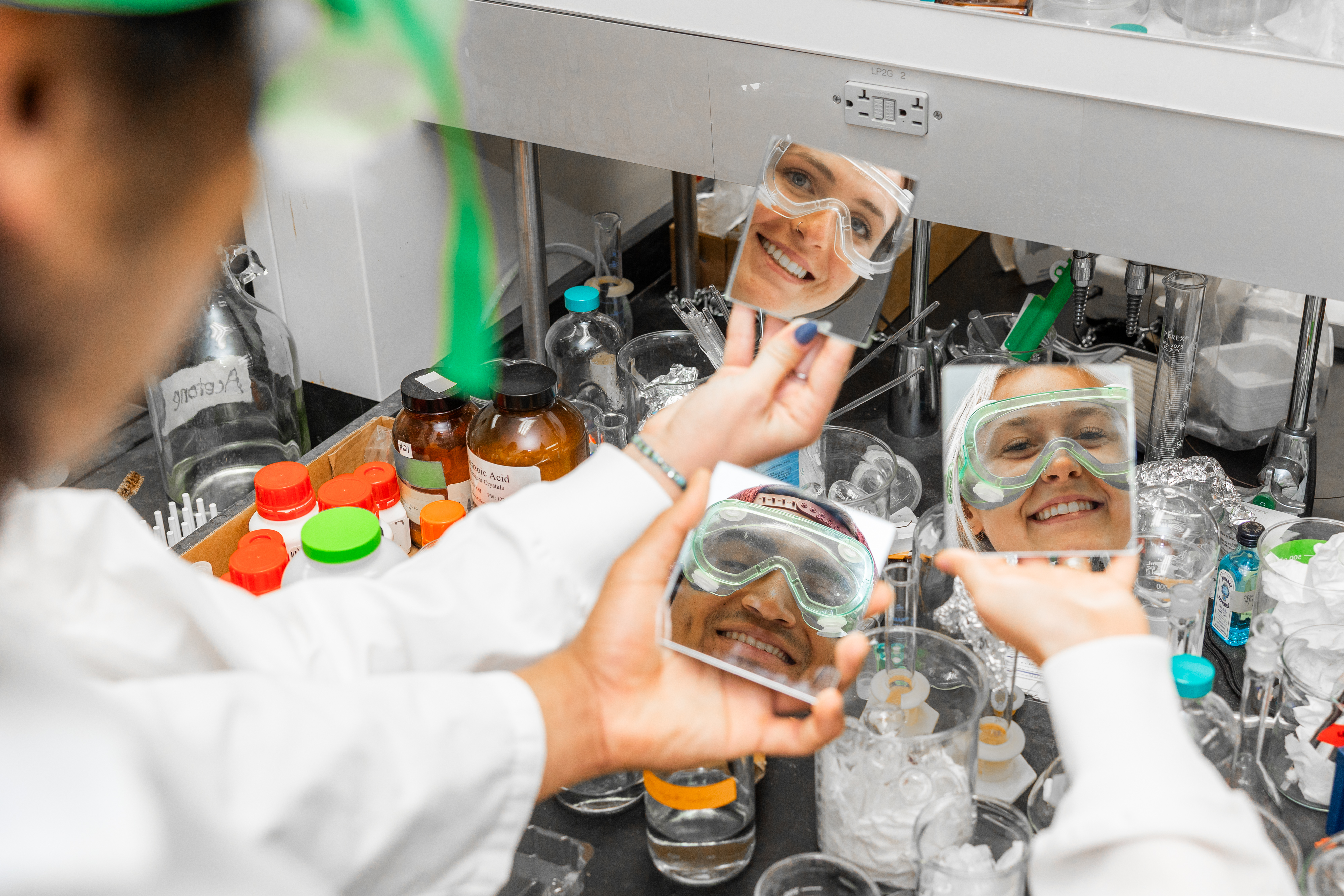 a person holding a mirror with a person's face in the mirror