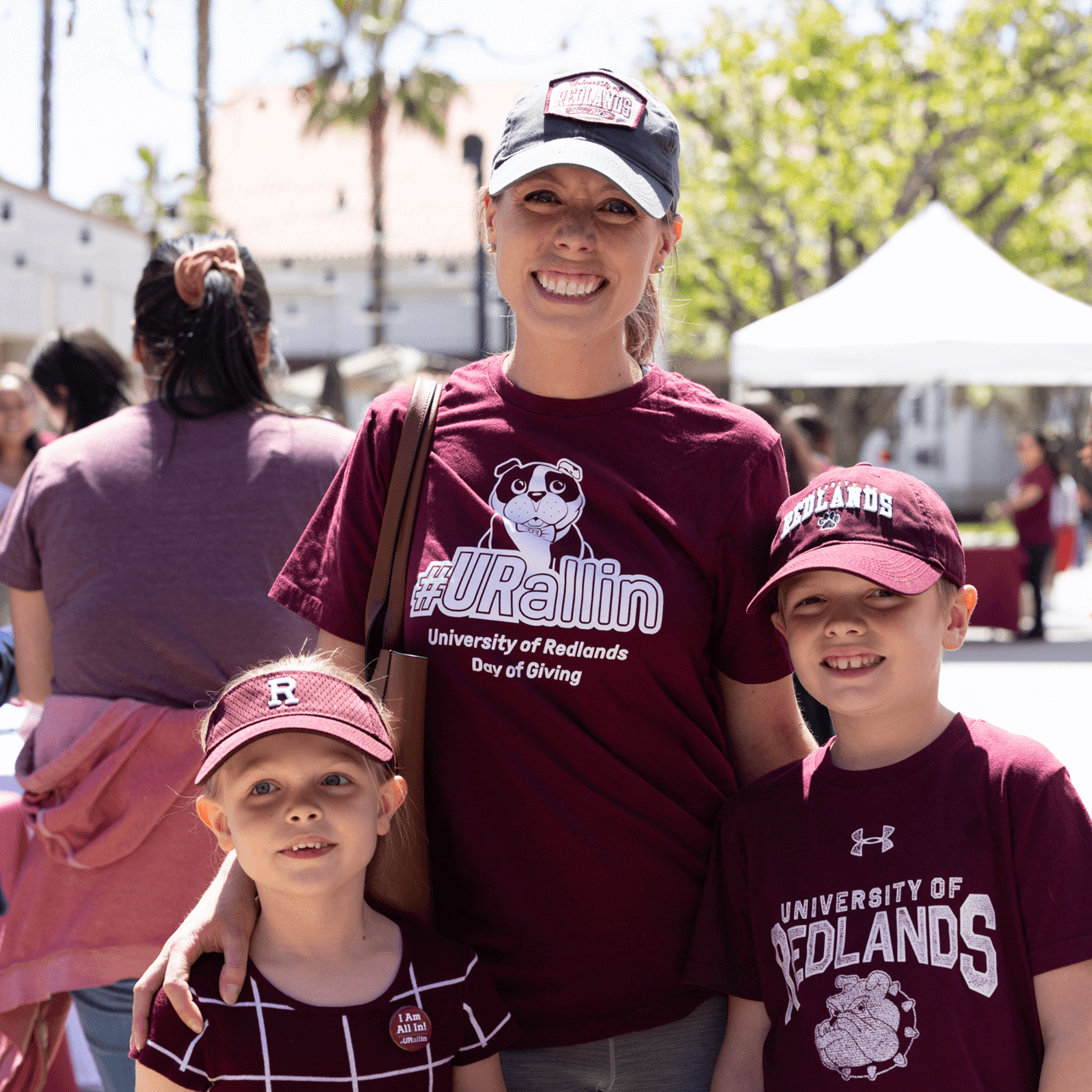 a person and two children posing for a picture