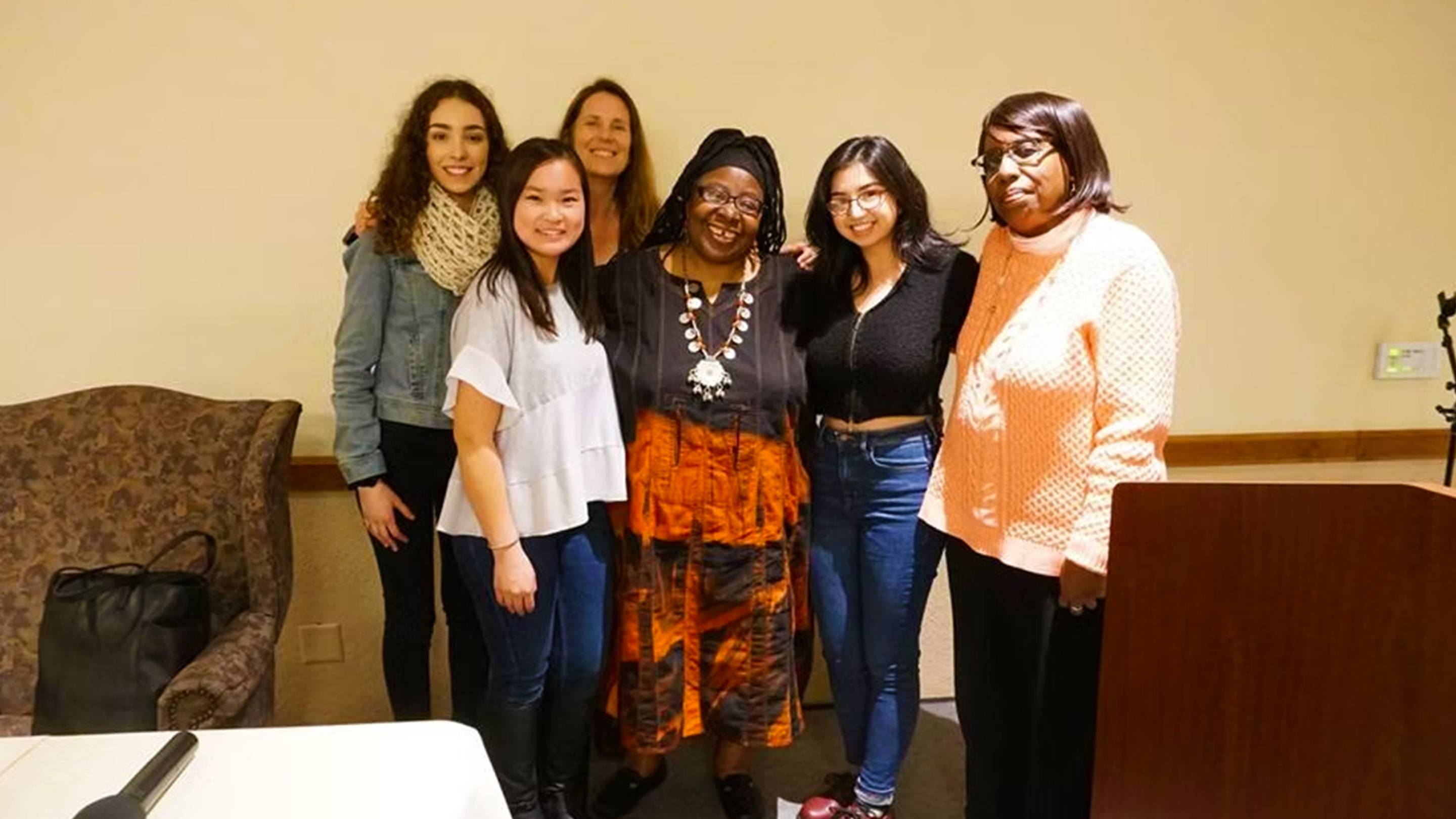 a group of women posing for a photo
