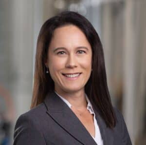 a person in a suit smiling