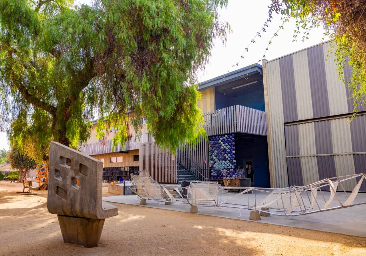 a tree next to a building