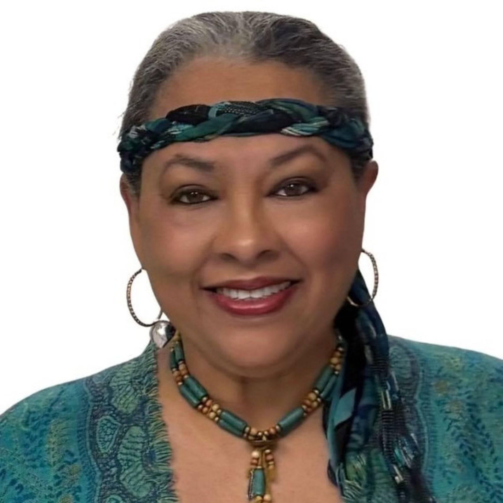 a person wearing a blue and green dress