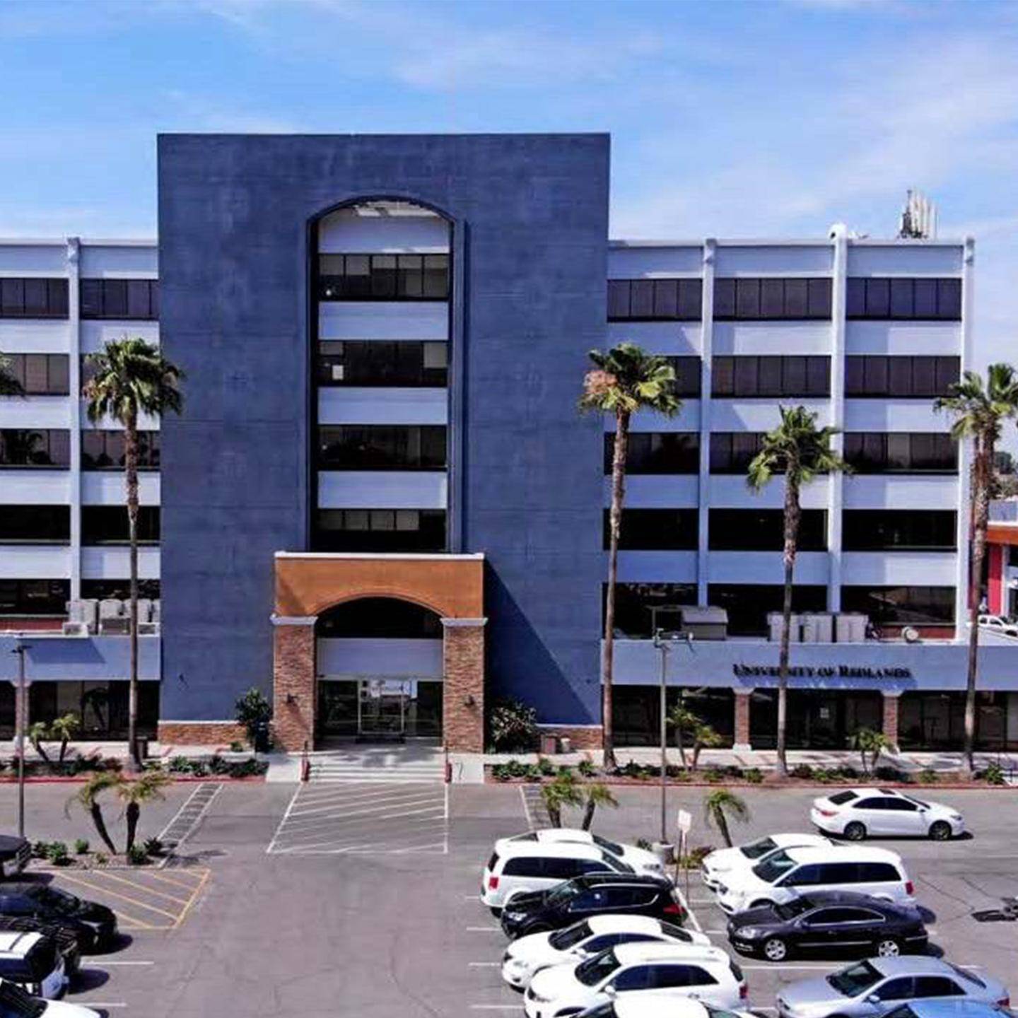 a building with persony cars parked in front of it