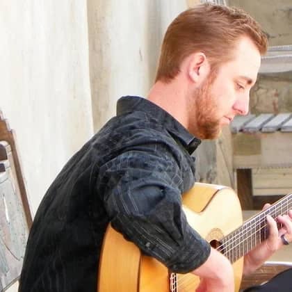 a person playing a guitar