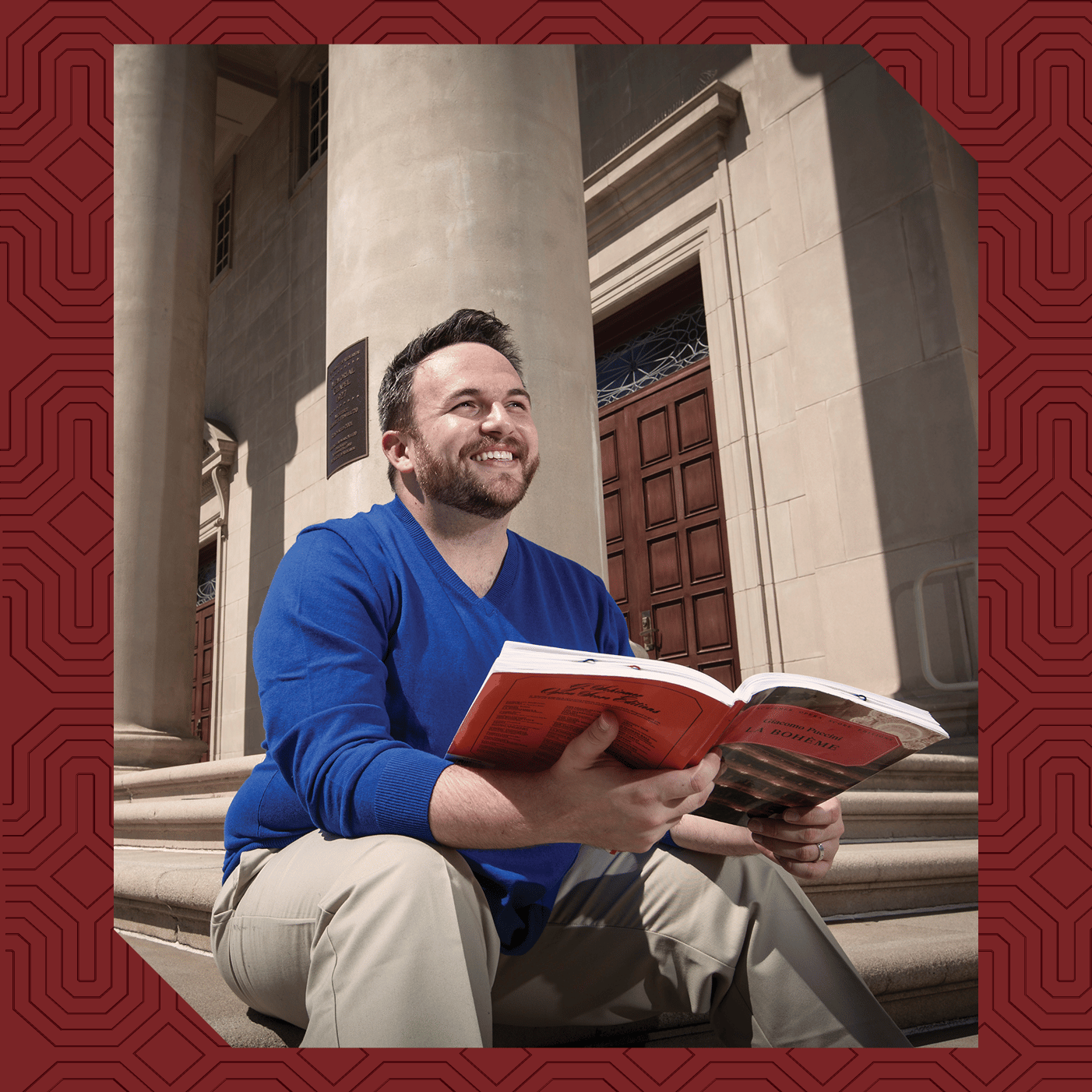 a person sitting on steps holding a book