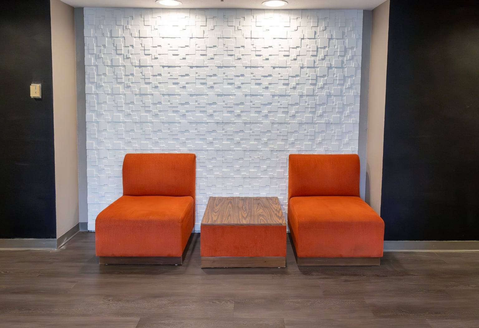 two chairs and a table in a room
