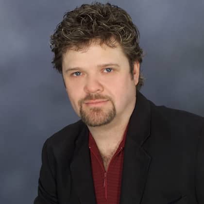 a person with a goatee and a beard
