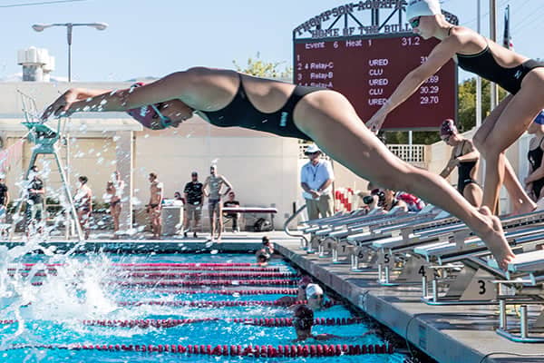 a person diving into a pool