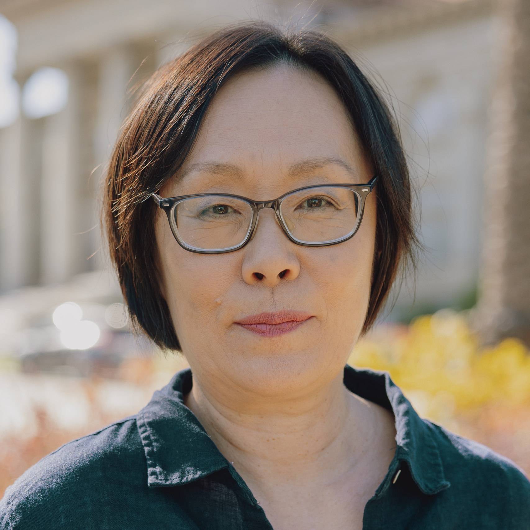 a person wearing glasses and a black shirt