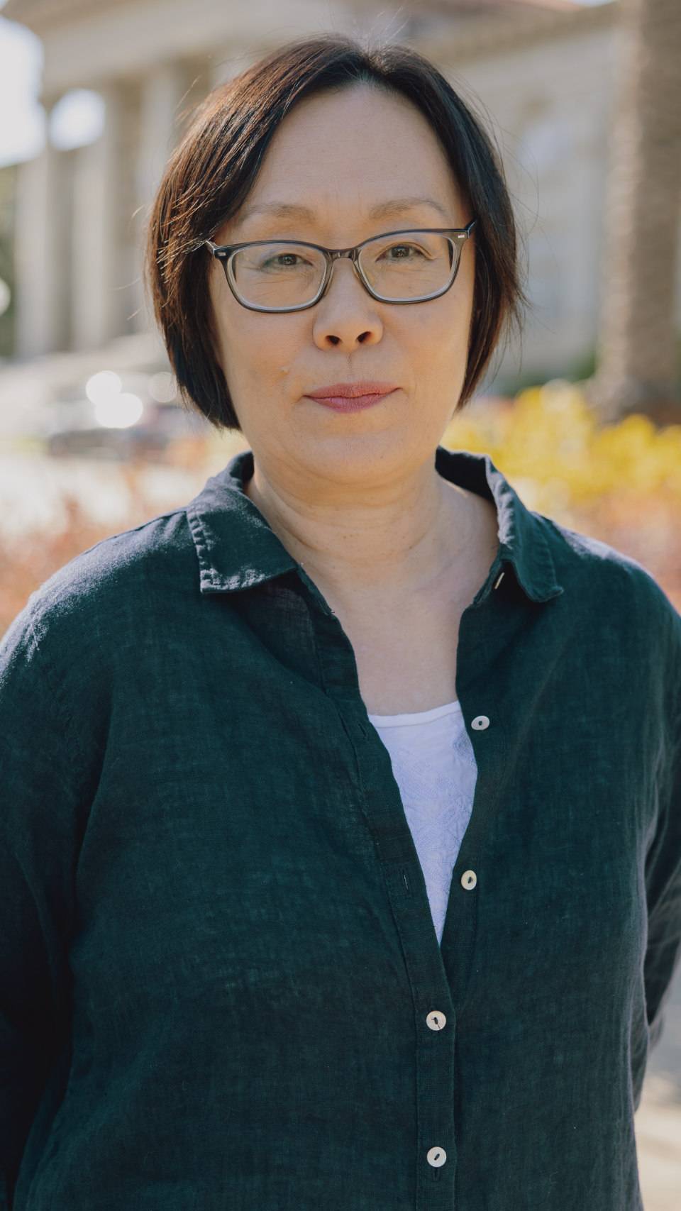 a person wearing glasses and a black shirt