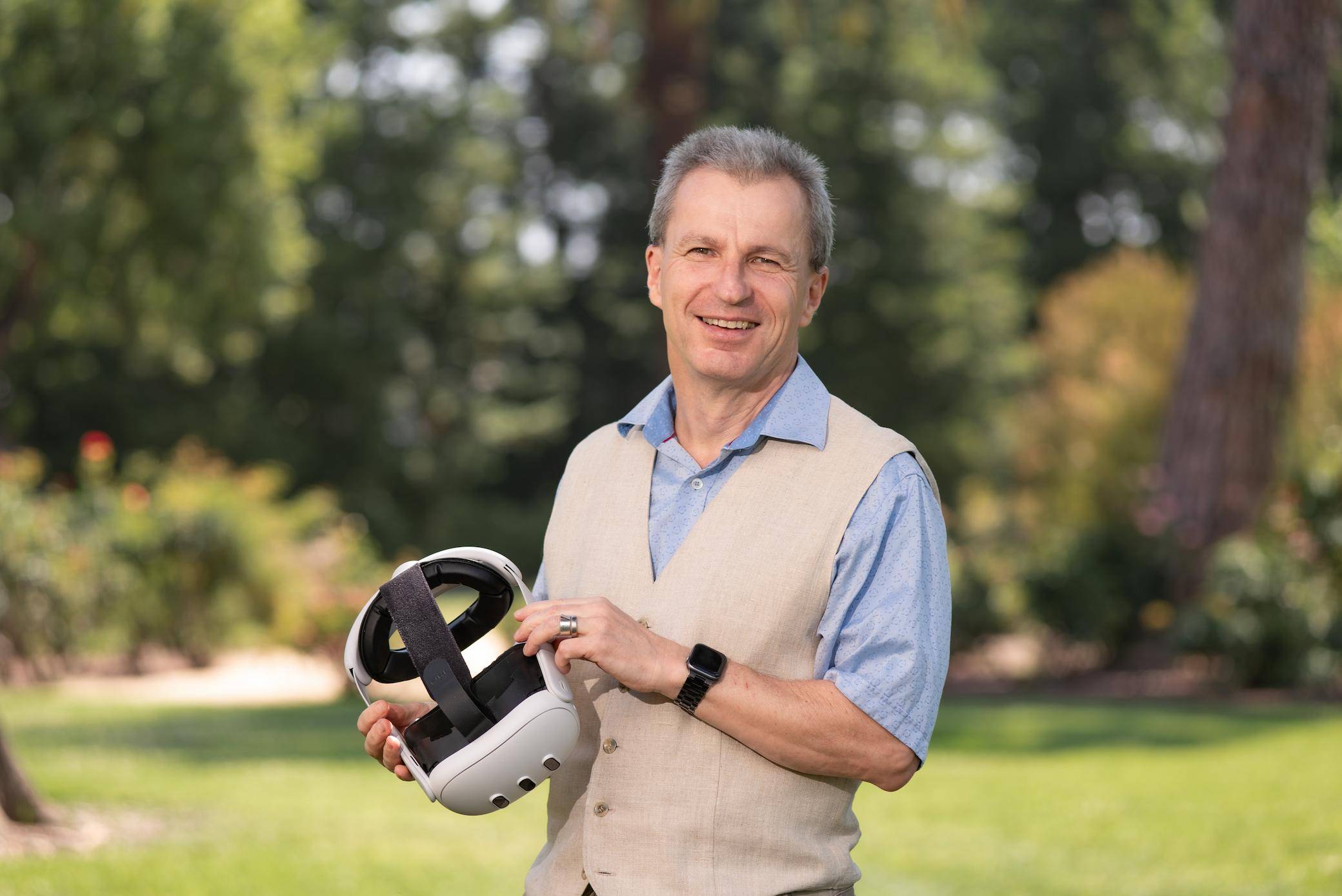 a person holding a white helmet