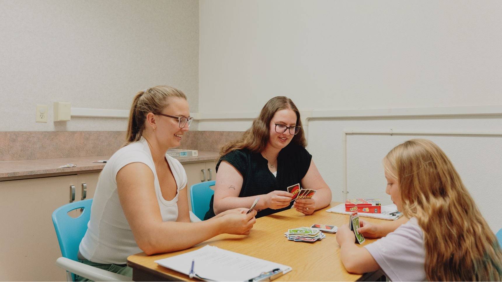 a group of women playing cards