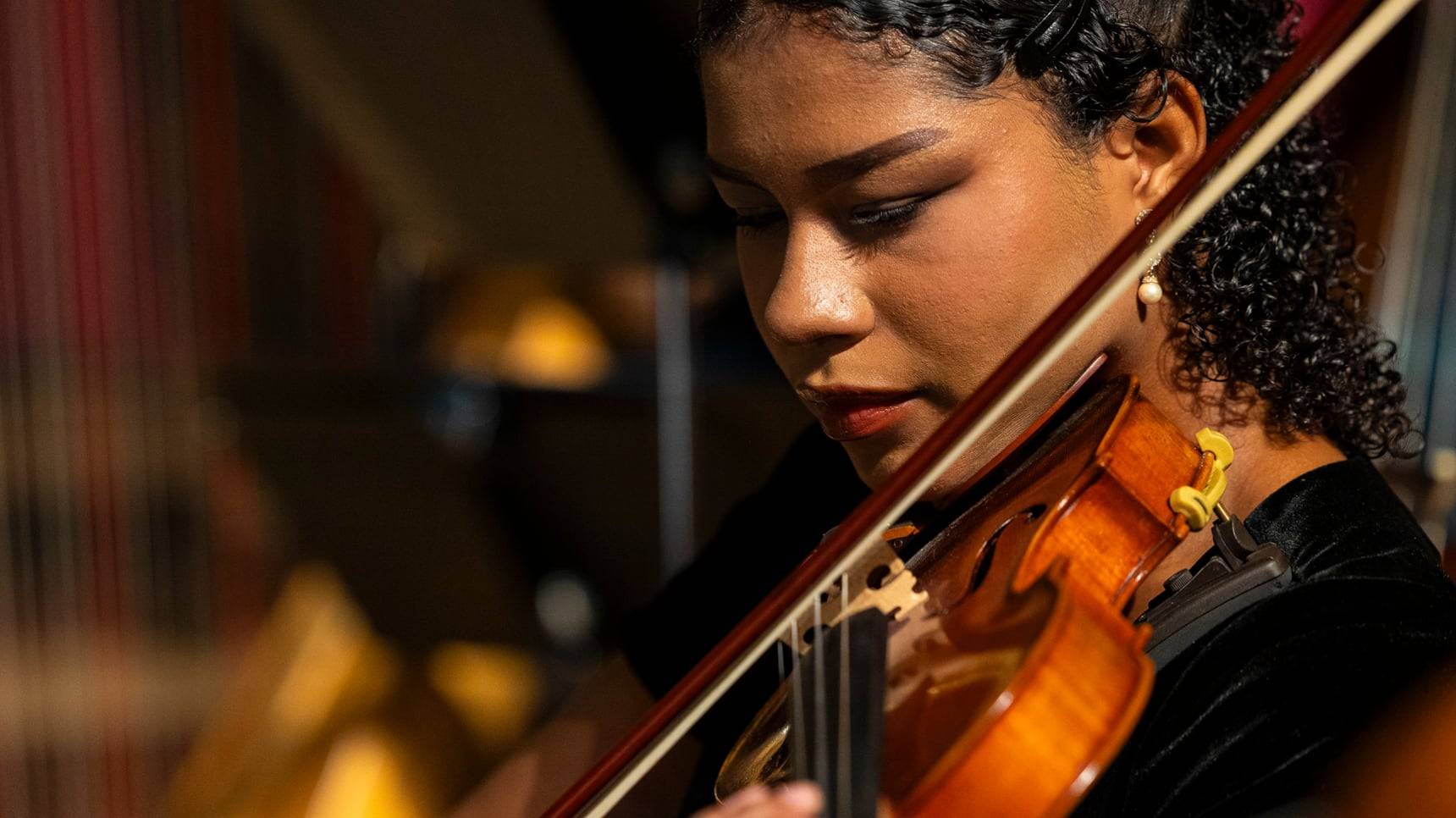a person playing a violin