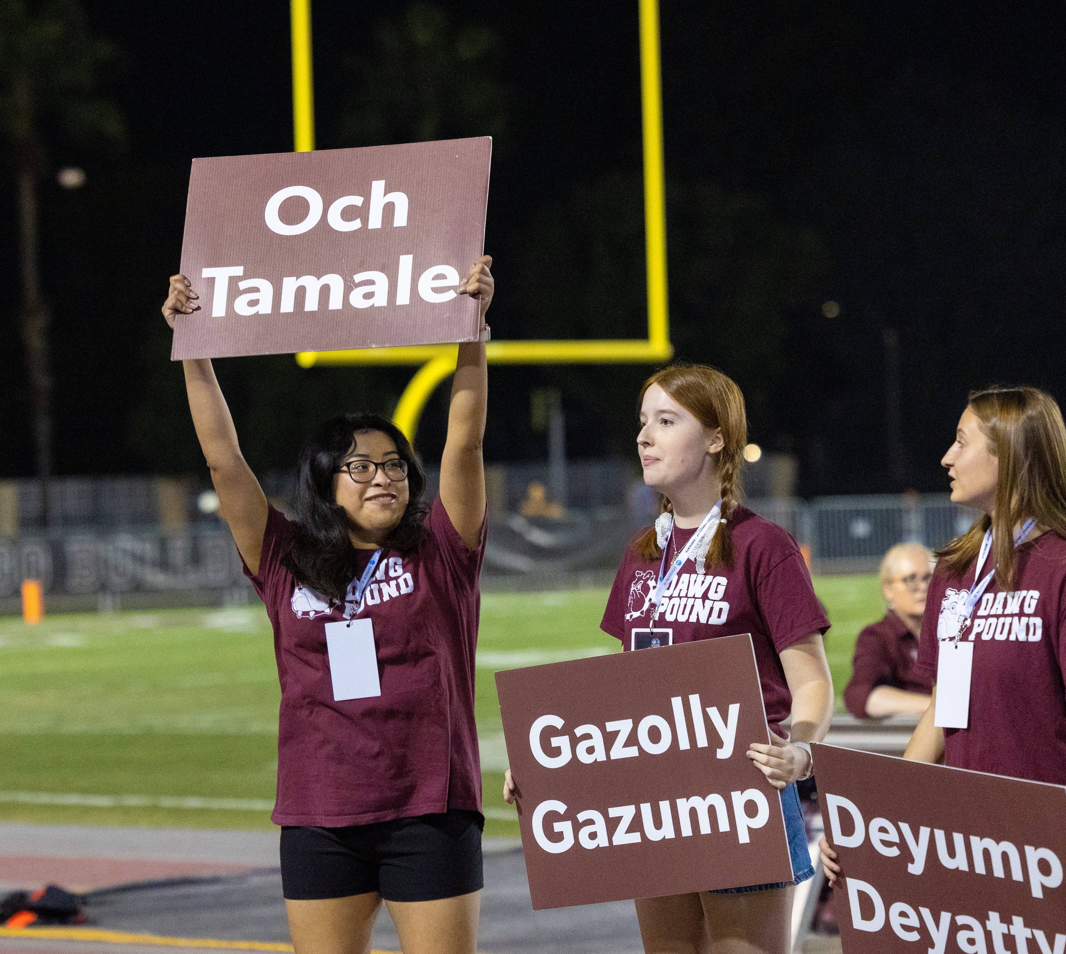 a group of women holding signs