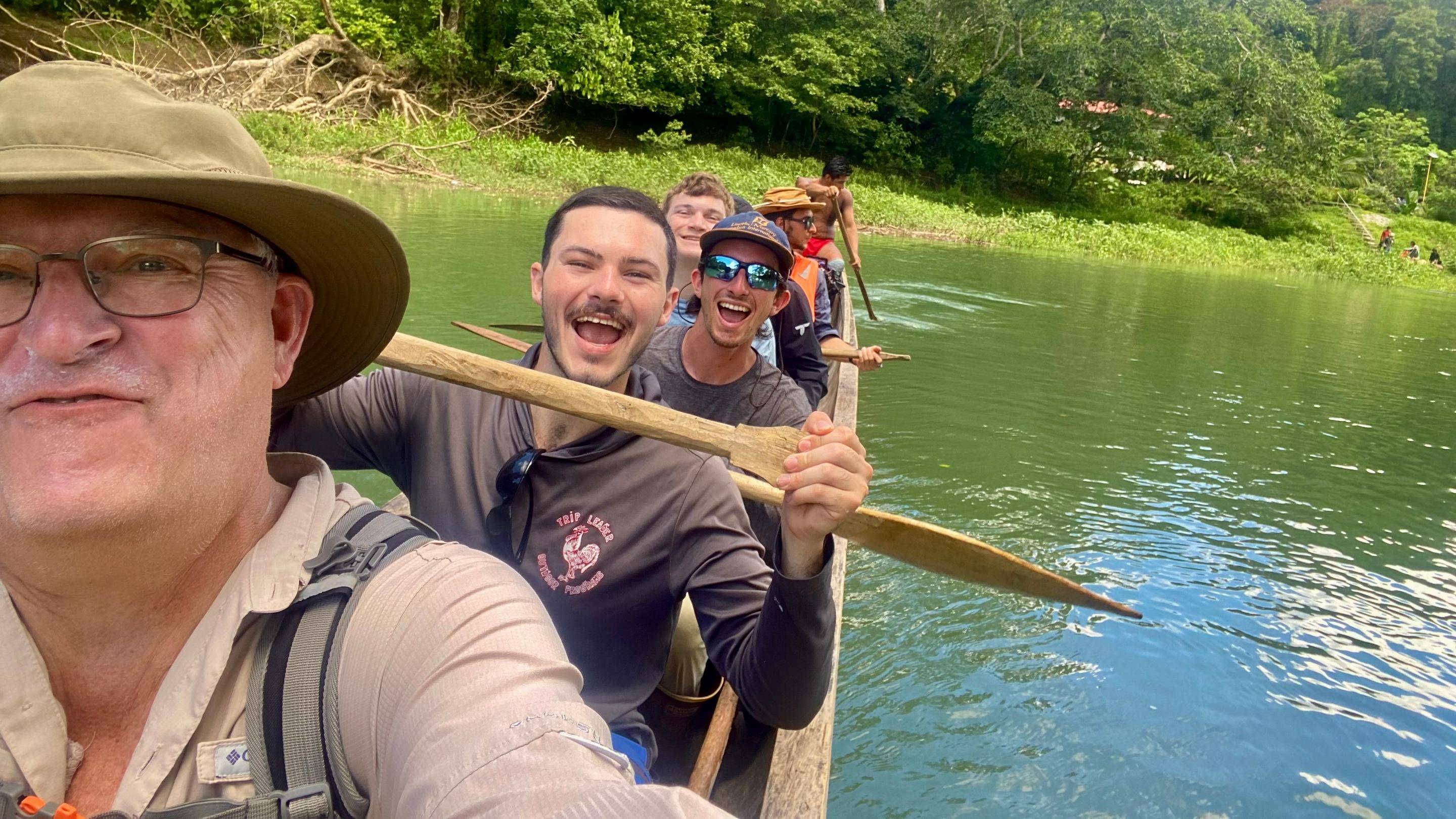 a group of people in a canoe
