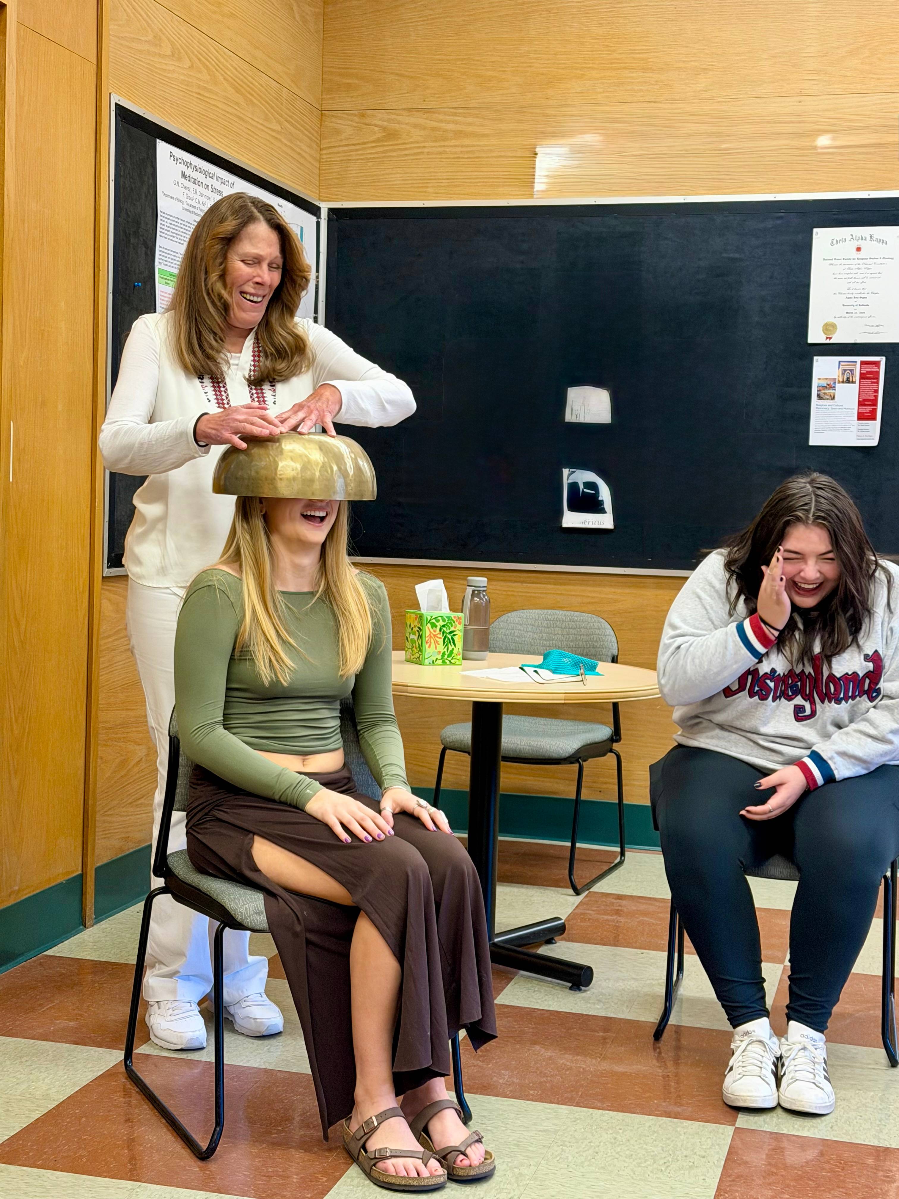 a person washing a bowl on a person's head