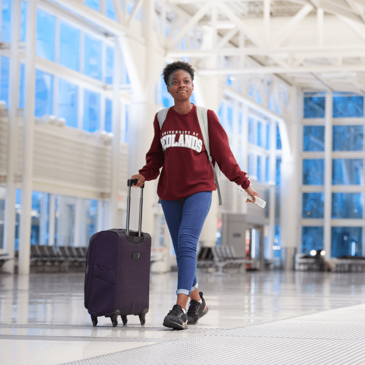 a person walking with a suitcase