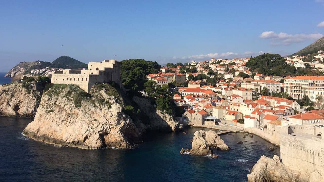 a city on a cliff by water