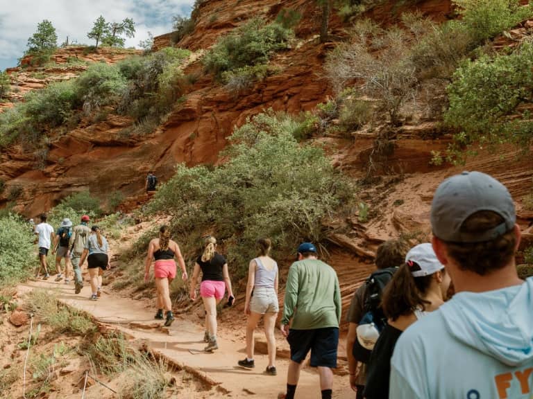 a group of people walking on a trail