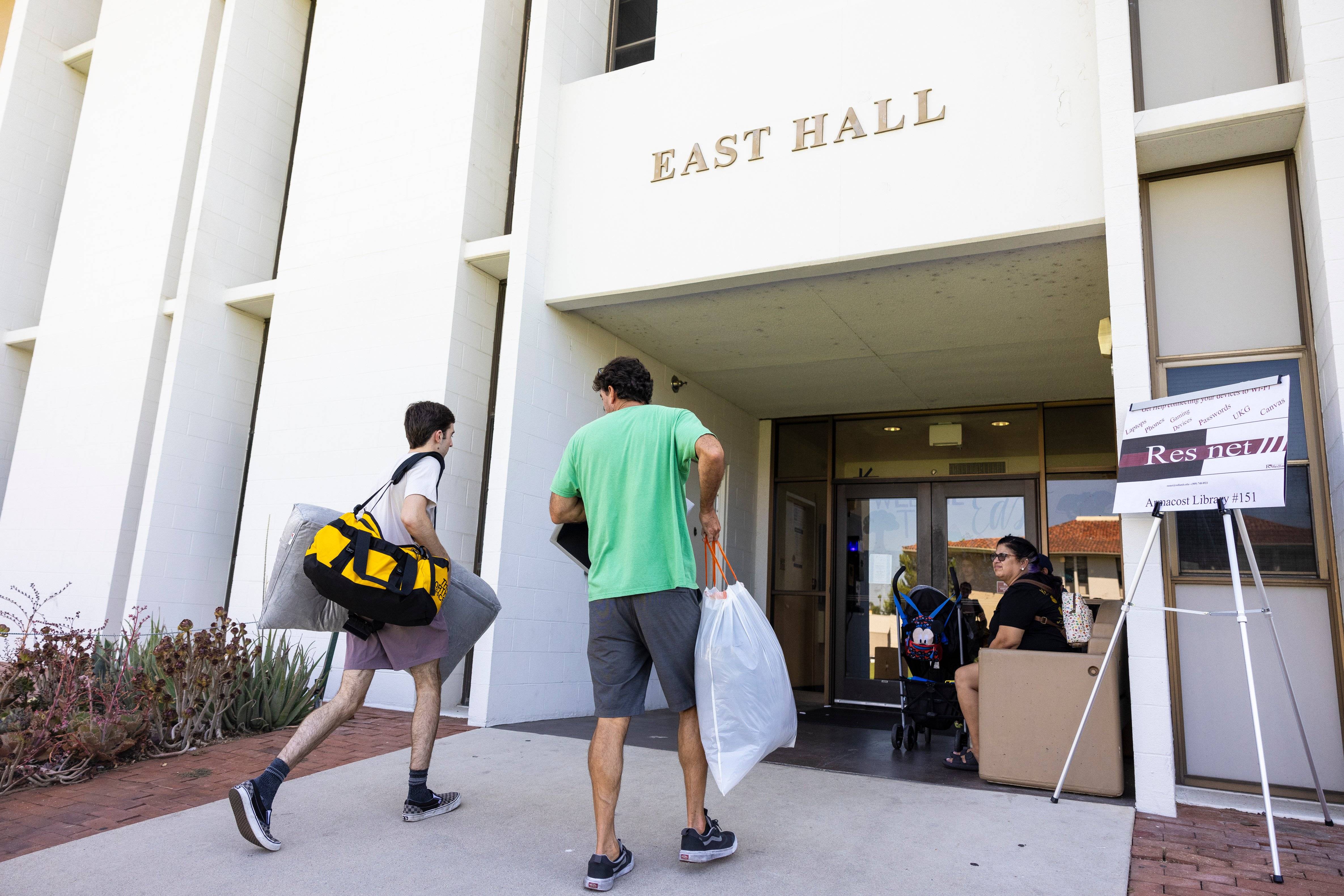 a group of people walking into a building