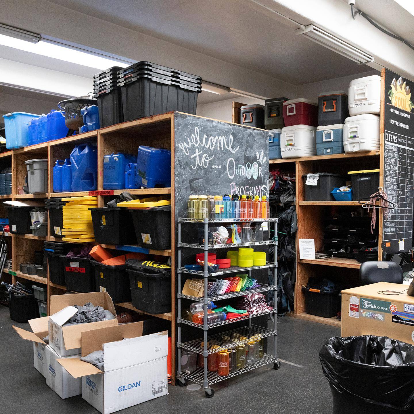 a room with shelves and bins