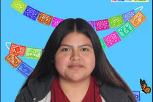 a person with long hair and a blue background with colorful flags