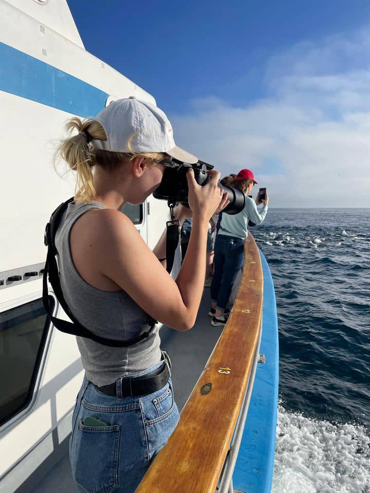 a person taking a picture of a boat