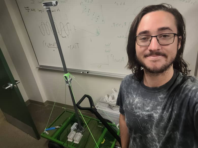 a person standing in front of a whiteboard