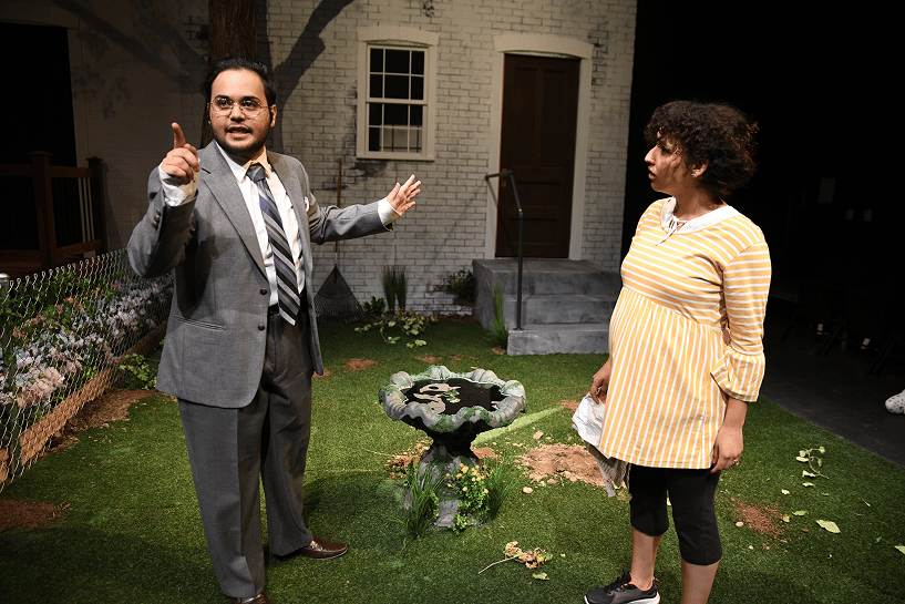 a person and person standing in a yard