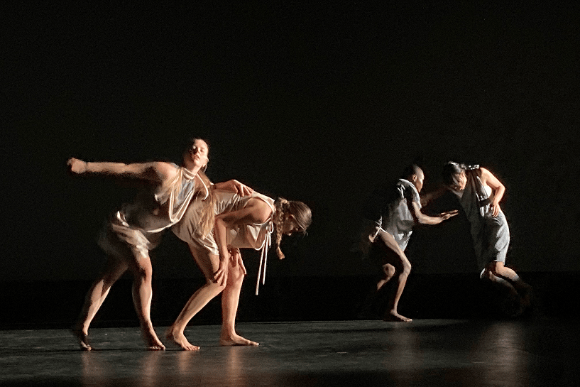 a group of people dancing on a stage