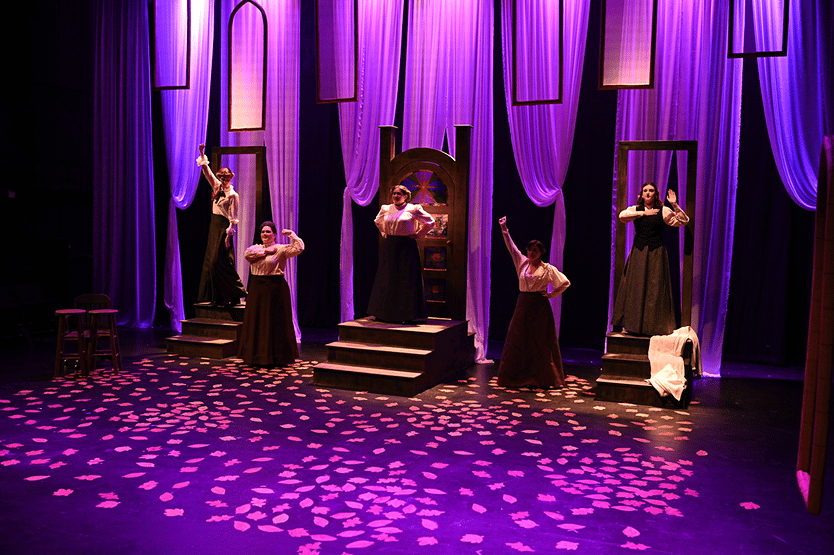 a group of women on stage