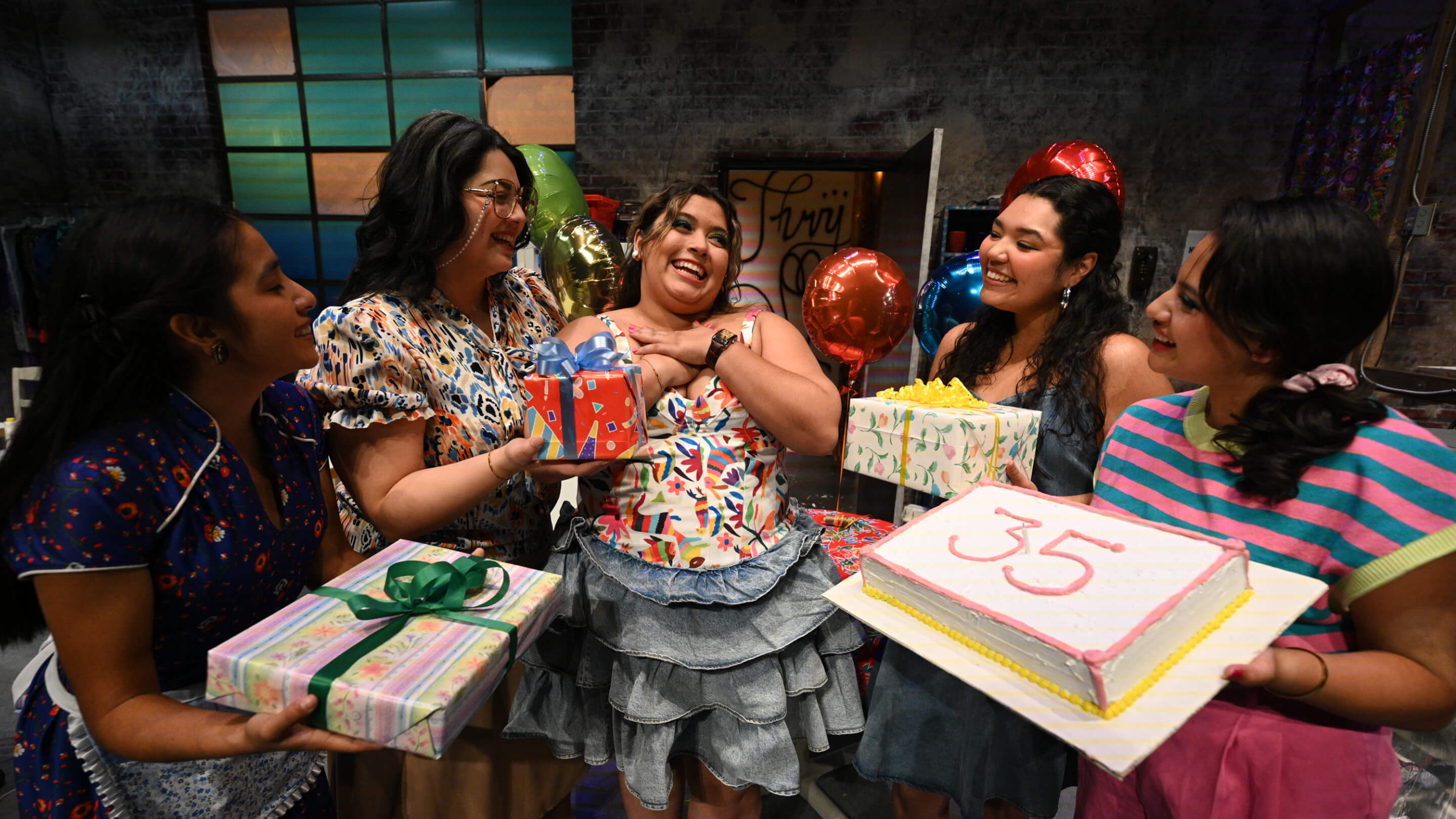 a group of women holding presents