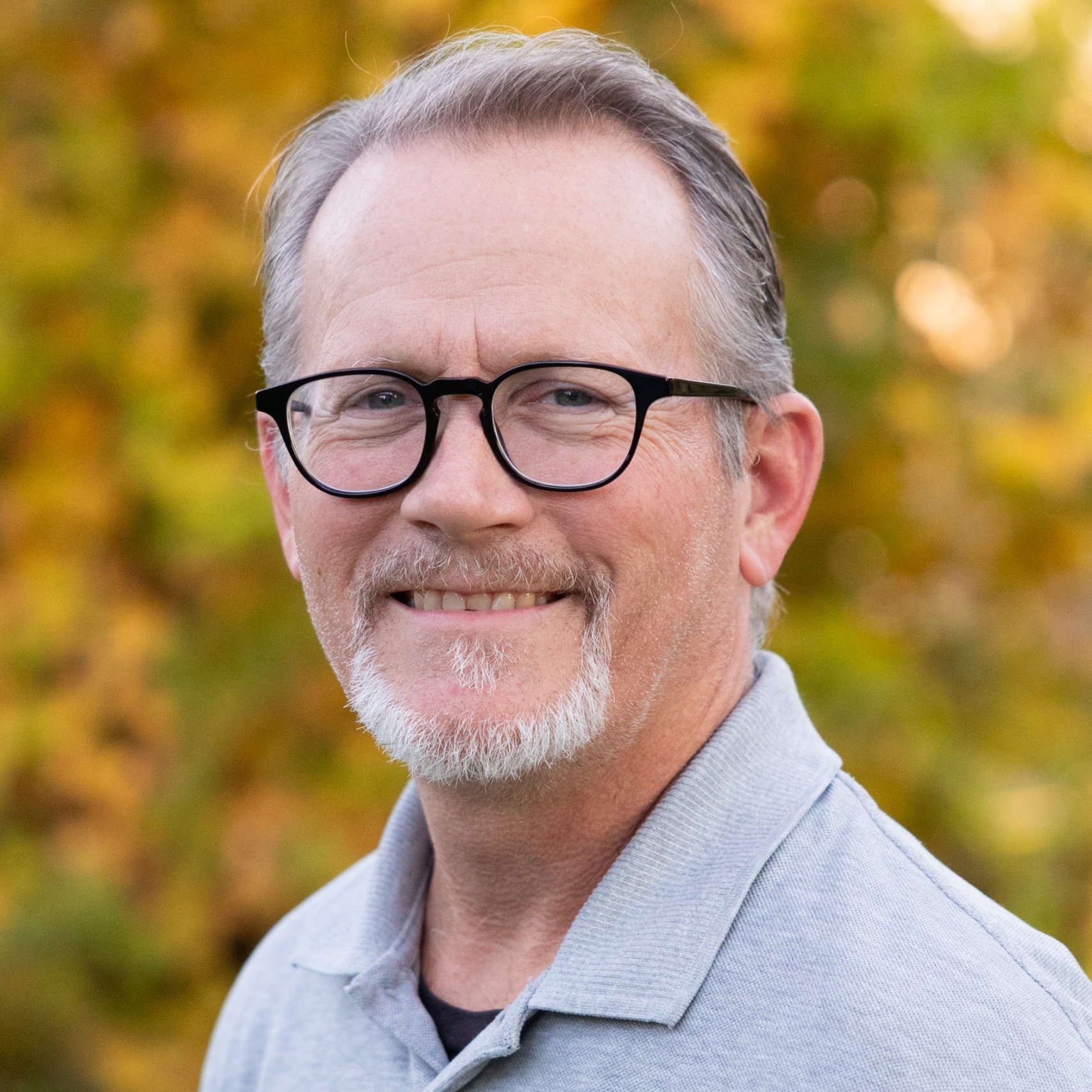 a man with glasses and a beard