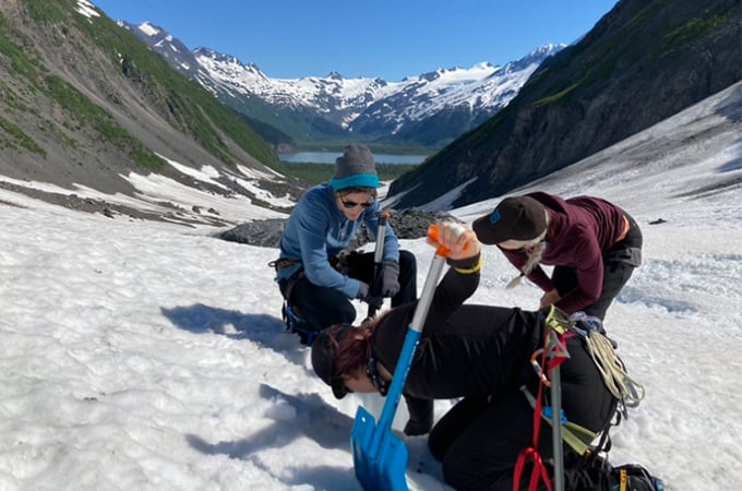 a group of people on a snowy mountain