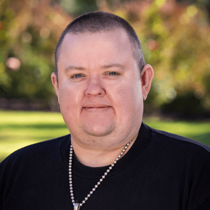 a man wearing a necklace