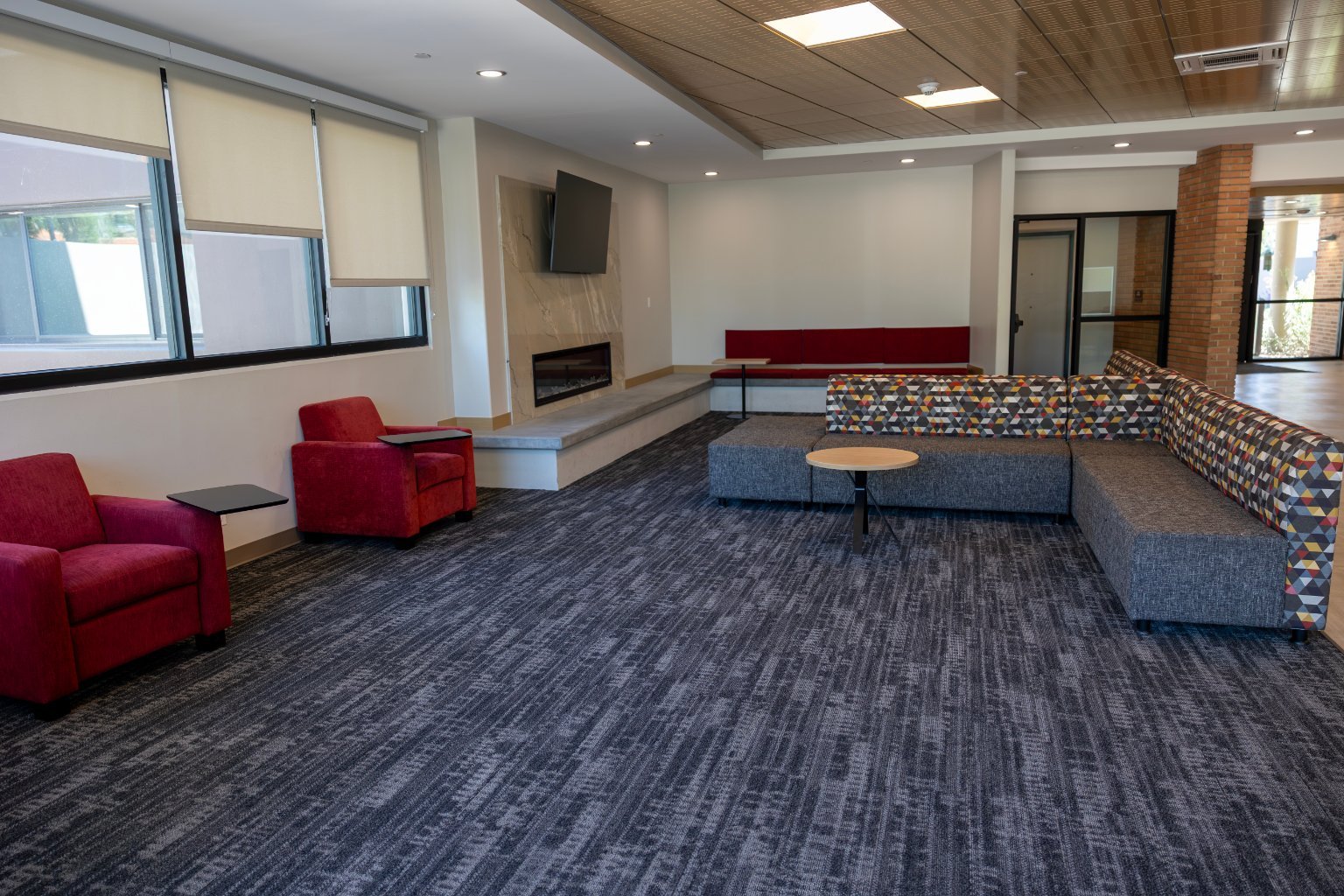 a room with a couch and a fireplace