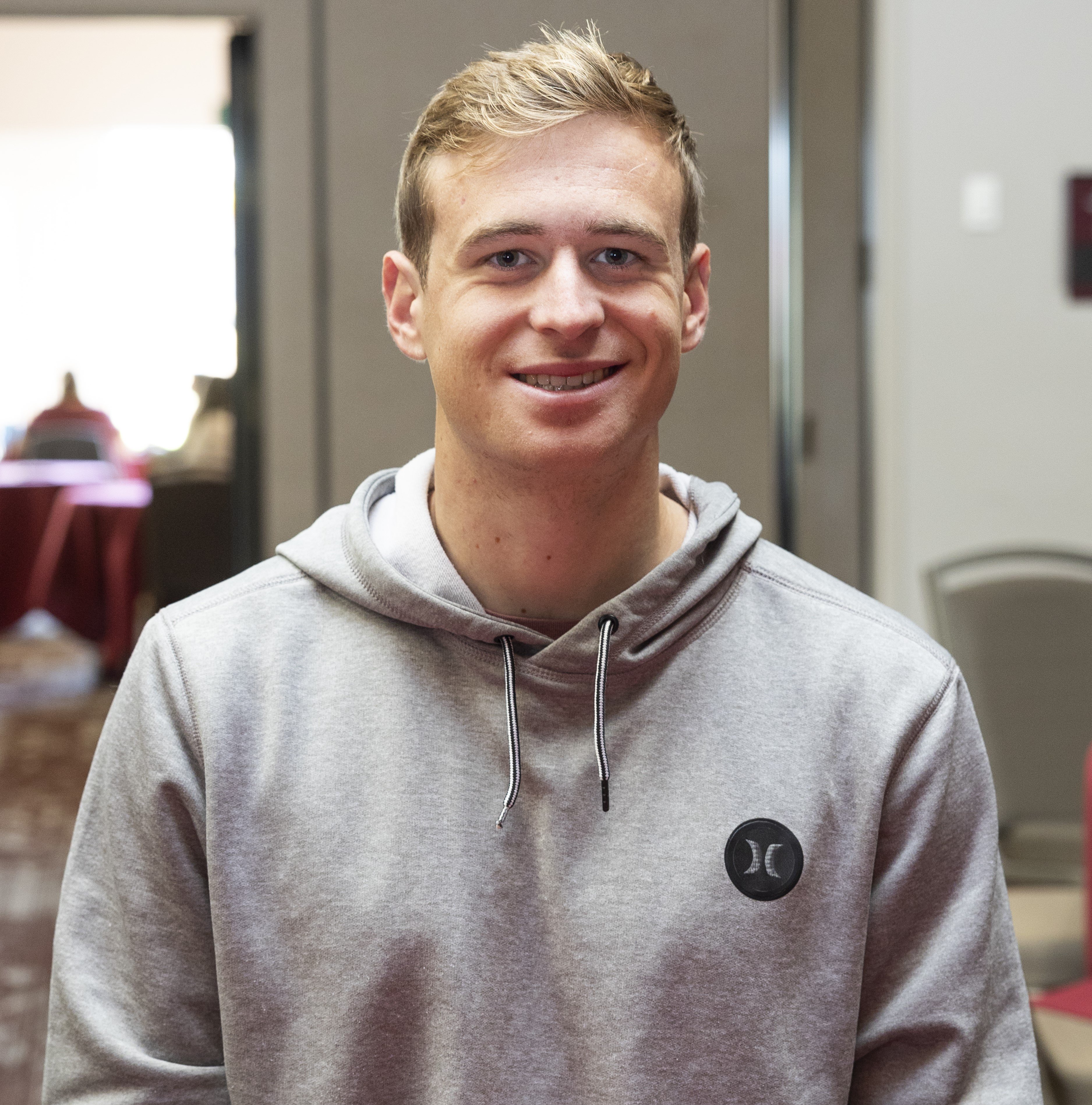 a man smiling for a picture