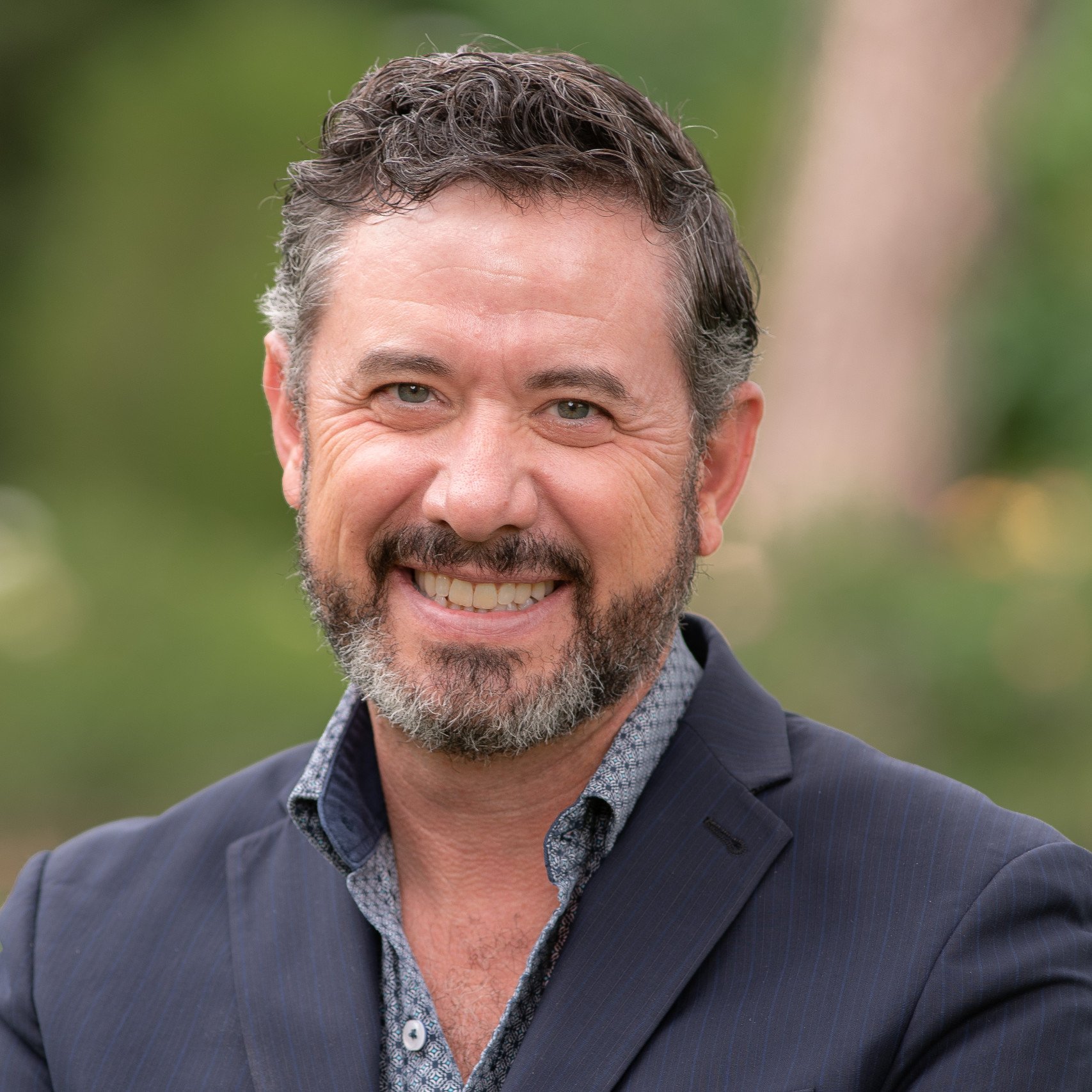 a man smiling for a picture