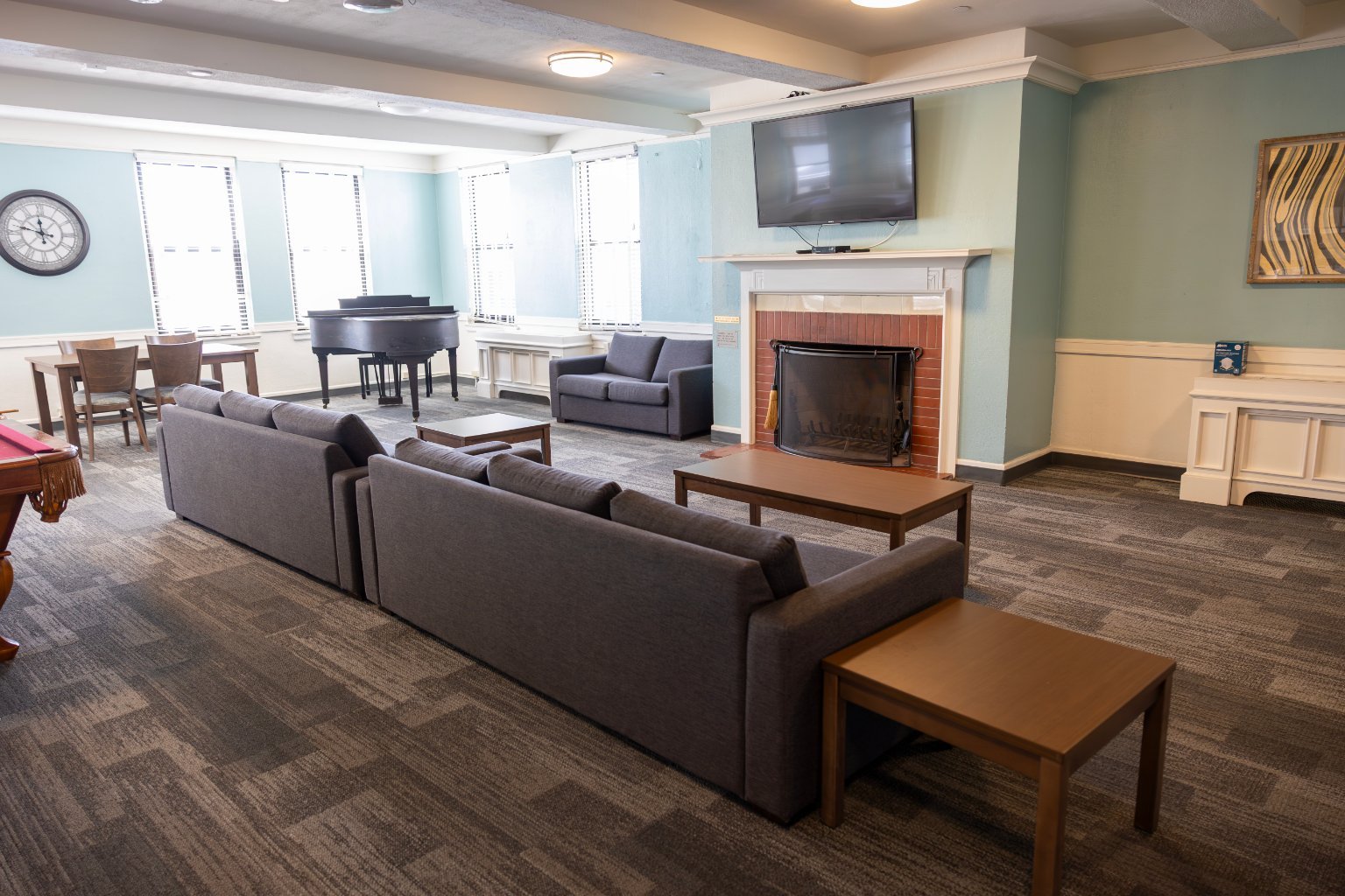 a room with couches and a fireplace