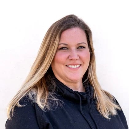 a woman with blonde hair smiling