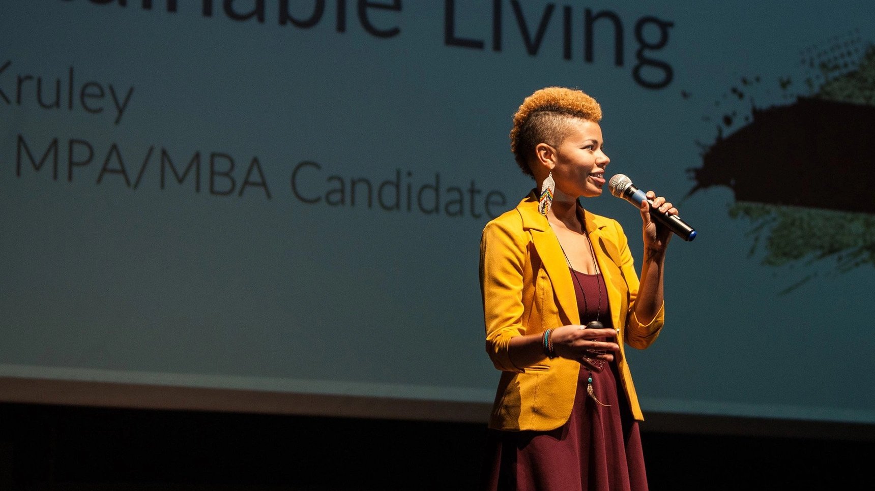 a woman speaking into a microphone