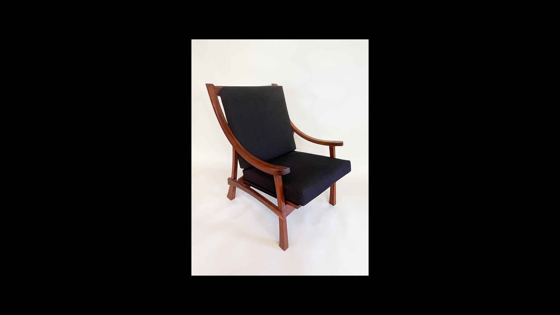 a black chair with wooden armrests