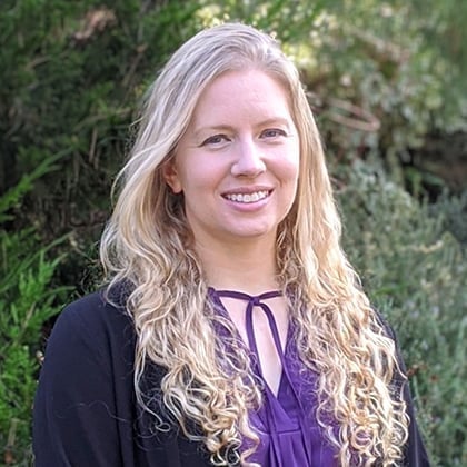 a woman with long blonde hair smiling